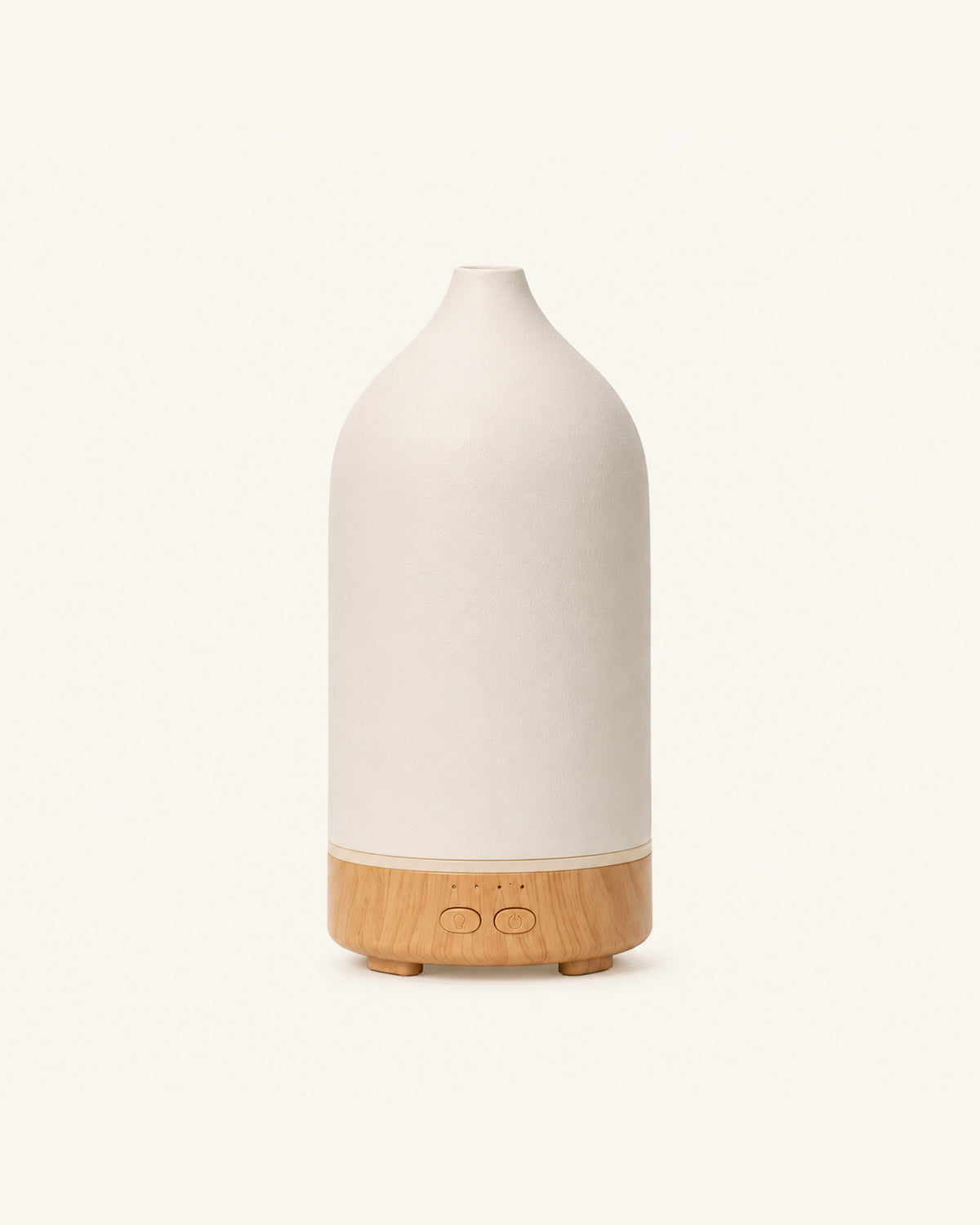 The Vagar ceramic diffuser, chalk-white cover on a wood-grain base, on a plain cream ground