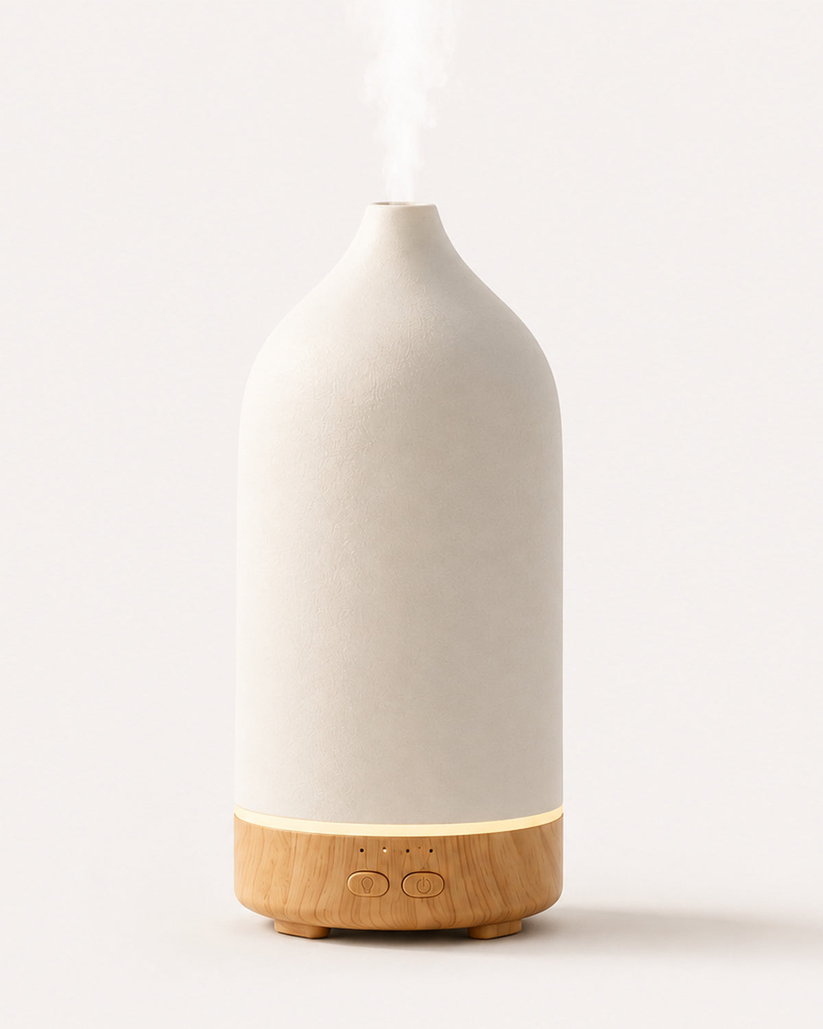 The Vagar ceramic diffuser misting, on a plain pale ground